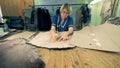 Seamstress is outlining contours on a furred skin