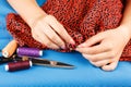 Seamstress is sewing cloth by hands. Royalty Free Stock Photo
