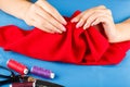Seamstress is sewing cloth by hands. Royalty Free Stock Photo