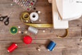 Seamstress or tailor background top view with sewing tools, colorful threads, sewing machine and accesories . Royalty Free Stock Photo