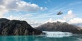Seaplane Aircraft Flying over the Pacific Ocean Coast and Rocky Mountains. Royalty Free Stock Photo