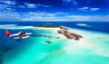 A seaplane approaching island in the Maldives