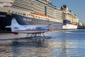 Seaplane in front of a big cruise ship in Juneau harbor Alaska.