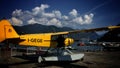 single-engined yellow Seaplane on land Royalty Free Stock Photo