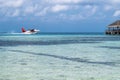 Seaplane landing in the ocean lagoon. Seaplane takeoff from the