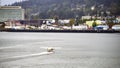 Seaplane landing on the water in Juneau, Alaska. Royalty Free Stock Photo