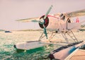 Seaplane moored on water with a propeller