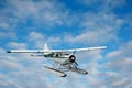 Seaplane over the clouds