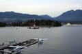 Seaplane port with a view to a seaside city with hills in the background in Vancouver, Canada