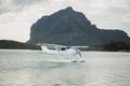 The seaplane is on the surface of the water. Mauritius. Royalty Free Stock Photo