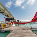 05.06.2018 - Ari Atoll, Maldives: Exotic scene with seaplane on Maldives sea landing. Vacation or holiday in Maldives concept back Royalty Free Stock Photo