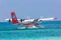 12.15.2015: Seaplane at tropical beach resort. Luxury summer travel destination with seaplane in Maldives islands