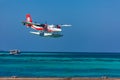 12.15.2015: Seaplane at tropical beach resort. Luxury summer travel destination with seaplane in Maldives islands