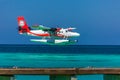 12.15.2015: Seaplane at tropical beach resort. Luxury summer travel destination with seaplane in Maldives islands