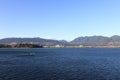 Seaplane on the water's surface against the background of the mountains. Vancouver, Canada. Royalty Free Stock Photo