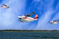 Seaplanes flying over Maldive islands beach Royalty Free Stock Photo