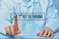 Search bar with the text we are hiring on the background of a doctor touching an abstract display. Medical staff.