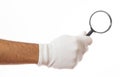 Search concept. Magnifying glass on a gloved hand palm isolated on white background, clipping path Royalty Free Stock Photo