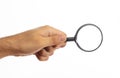Search concept. Magnifying glass on a hand palm isolated on white background, clipping path Royalty Free Stock Photo
