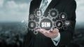 Search engine marketing - SEM concept. Businessman or programmer is focused to improve SEM and web traffic.