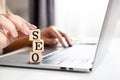 Search Engine Optimization concept with woman hand typing on keyboard laptop , using SEO for search engine Royalty Free Stock Photo