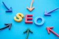 Search Engine Optimization SEO ranking digital marketing strategy concept. Color highlight arrows around SEO alphabets word