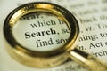 Search And Find Concept With Closeup Golden Magnifying Glass