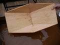 Search for gold nuggets in the gold-bearing rock in the old way using a wooden tray.