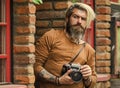 search for inspiration. hipster man with beard use professional camera. photographer retro camera. journalist is my