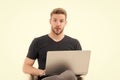 In search of inspiration. Man with laptop surprised inspired face found idea. Guy handsome unshaven in black shirt works