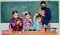 In search of right medical solution. back to school. kids in lab coat learning chemistry in school laboratory. chemistry Royalty Free Stock Photo
