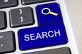 Search text on blue laptop keyboards. Web search concept