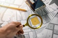 Searching building plot for family house construction - hand with magnifier on cadastre map Royalty Free Stock Photo