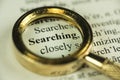 Searching Concept With Closeup Golden Magnifying Glass Royalty Free Stock Photo