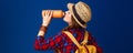 Healthy traveller woman on blue background drinking water