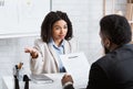 Searching for work. Human resources manager communicating with employment applicant on job interview at office Royalty Free Stock Photo