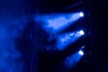 The searchlight beams of blue light through theatrical smoke Royalty Free Stock Photo