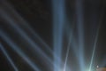 Searchlights shining beams of light into the black sky. Royalty Free Stock Photo