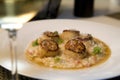 Seared scallops on a bed of risotto Royalty Free Stock Photo