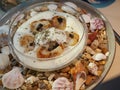 Seared scallops in a glass bowl in creamy souse sprinkled with dried nori Royalty Free Stock Photo