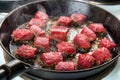 Searing beef cubes Royalty Free Stock Photo