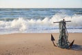 Seascape anchor on the sandy beach of the sea