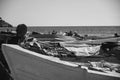 Seascape of a beach with many boats and fishing gear