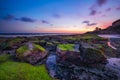 Seascape. Beach with rocks and stones. Low tide. Sunset time. Slow shutter speed. Soft focus. Melasti beach, Bali, Indonesia Royalty Free Stock Photo