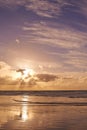 Seascape of a beautiful sunset on the west coast of Jutland in Loekken, Denmark. Sun setting on the horizon on an empty