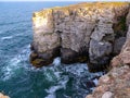 Seascape on the Black Sea, high steep stone coast with inaccessible rocks near the village of Tyulenovo, Bulgaria