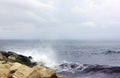 Seascape. Blue sky. Rocky beach. Sea. Waves are breaking on the shore. Bank is located on the left. Waves break on the shore. Royalty Free Stock Photo