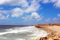 Seascape. Blue sky. Rocky Beach. Sea. Waves are hitting the shore Royalty Free Stock Photo