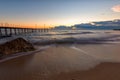 Seascape with bridge and rock.