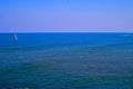 Seascape and catamaran sailing boat in front of Kibbutz Sdot Yam north Israel